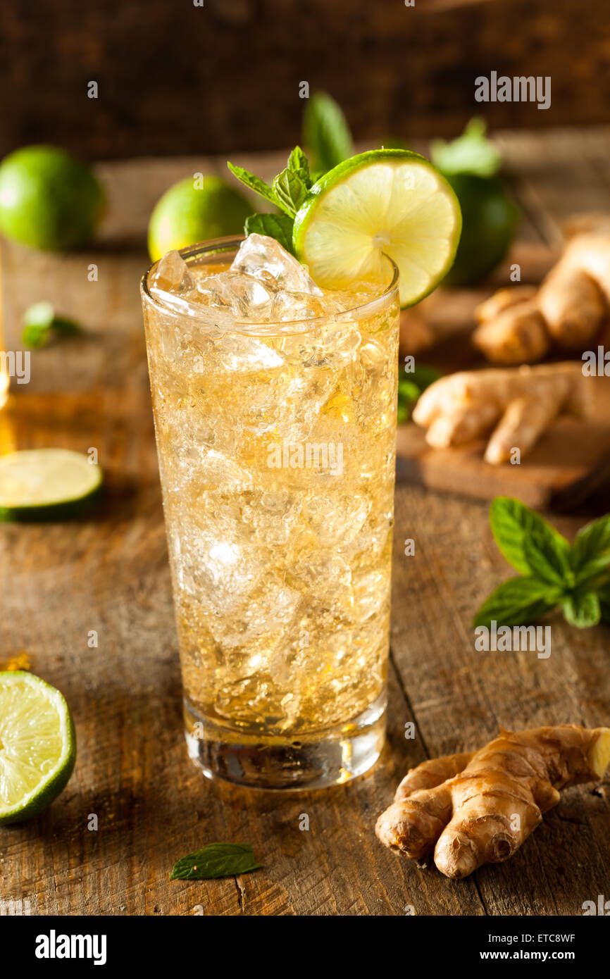 Refreshing Golden Ginger Beer with Lime and Mint Stock Photo