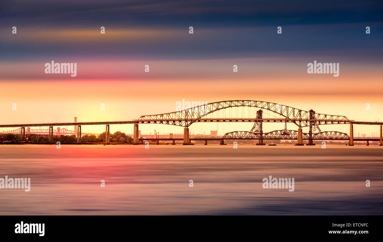 Newark Bay Bridge and sunset. Newark Bay Bridge, officially known as Vincent R. Casciano Memorial Bridge Stock Photo
