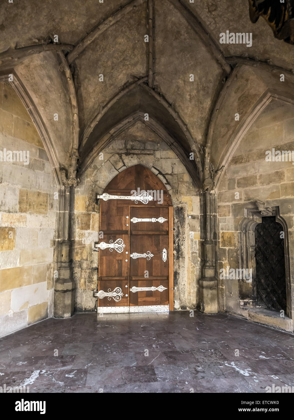 Gothic wooden doorway with metal fitting Stock Photo