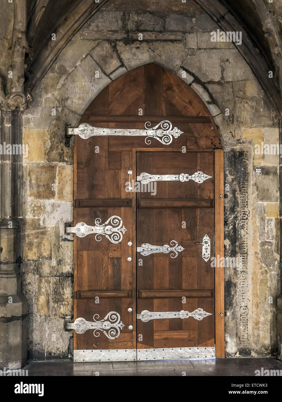 Gothic wooden doorway with metal fitting Stock Photo