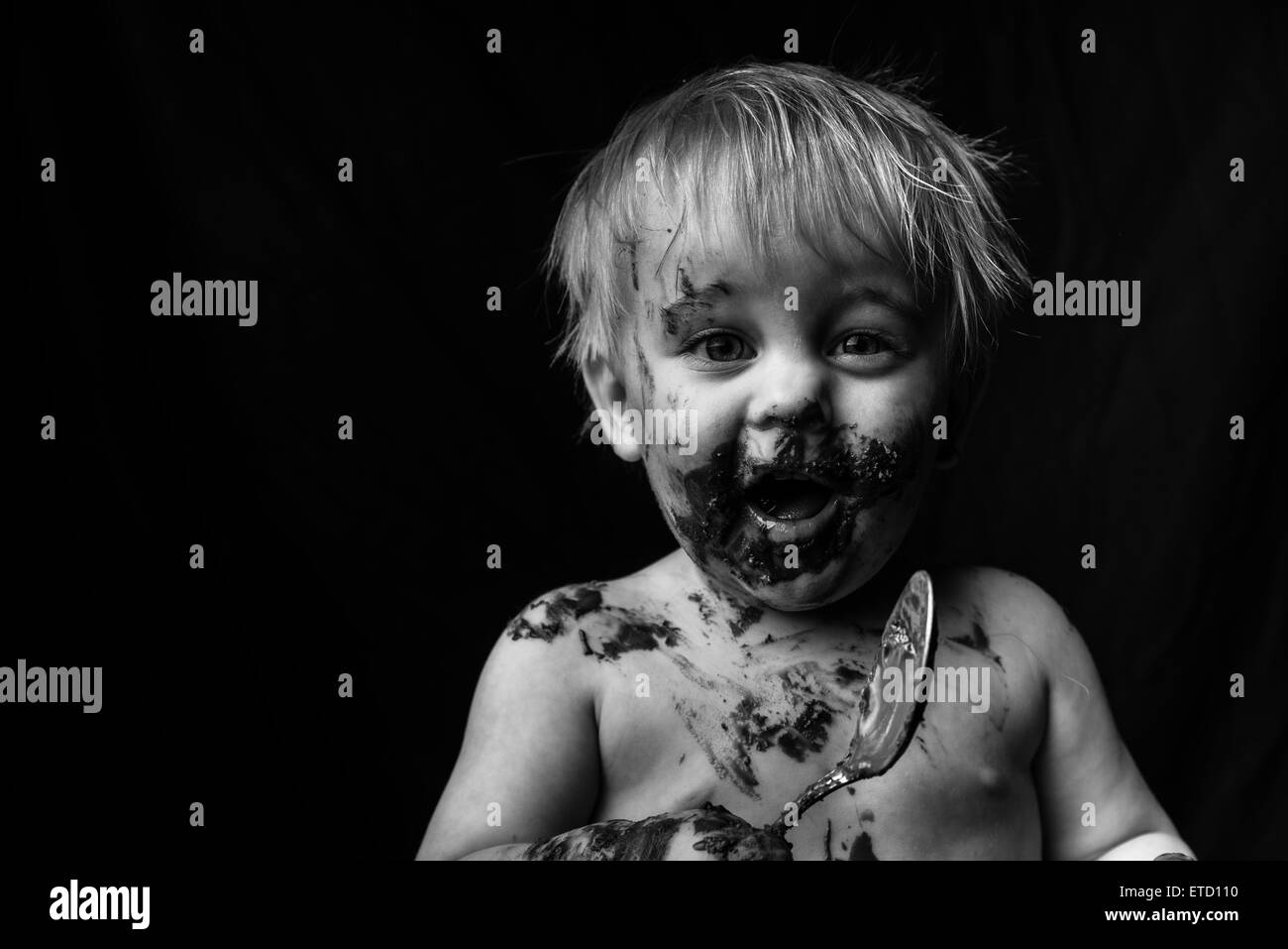 A young boy with chocolate on his face Stock Photo Alamy