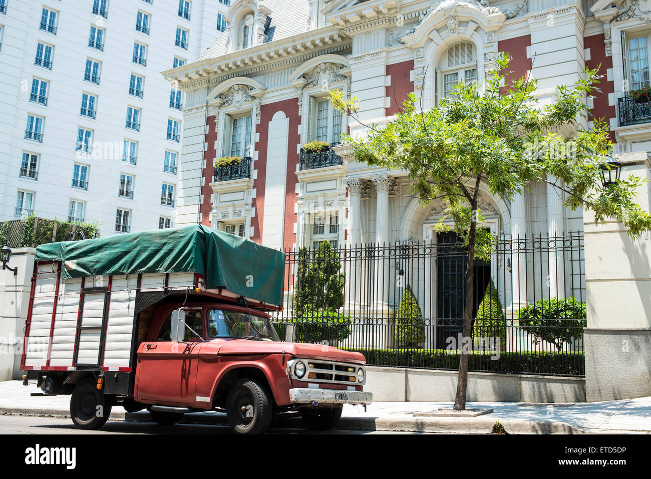 Old pick-up truck outside grand residence, Buenos Aires, Argentina Stock Photo