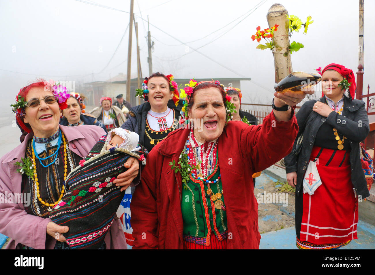 Bulgarian women dress up for a carnival in celebration of Midwife Day in  the village of Topoli east of the Bulgarian capital Sofia. Midwife Day is  one of the most popular holidays