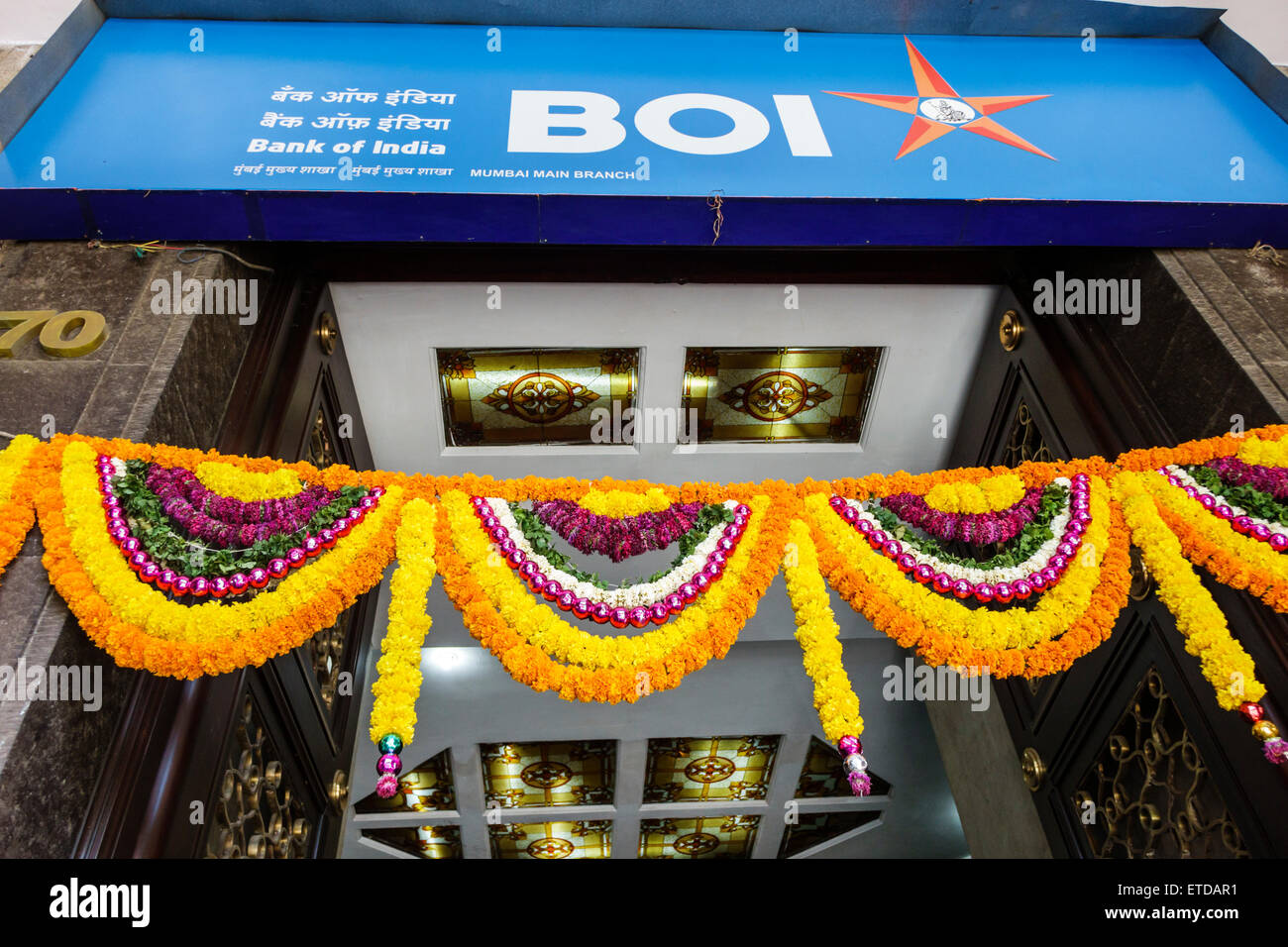 Mumbai India,Fort Mumbai,Kala Ghoda,Bank of India,entrance,flowers,wreaths,India150302011 Stock Photo
