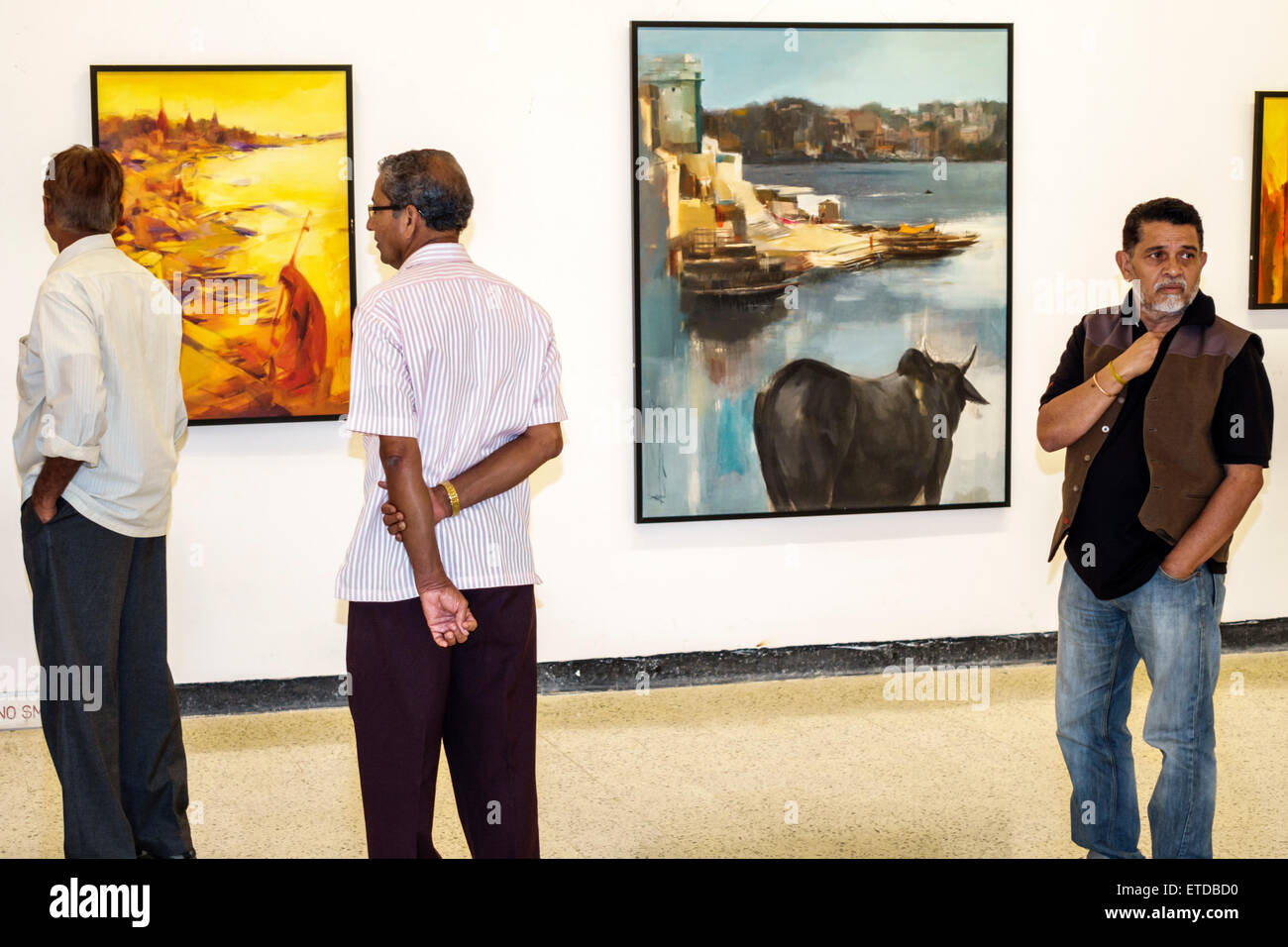 Mumbai India,Indian Asian,Fort Mumbai,Kala Ghoda,Jehangir Art Gallery,contemporary,paintings,adult adults man men male,friend,looking watching,artist Stock Photo
