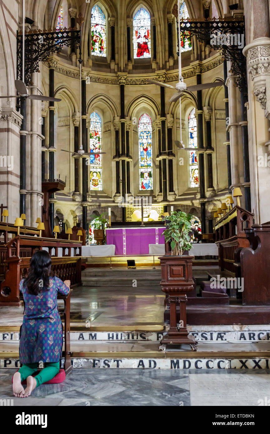 Mumbai India,Fort Mumbai,Kala Ghoda,St. Thomas Cathedral Church,interior inside,woman female women,kneeling,praying,India150302114 Stock Photo