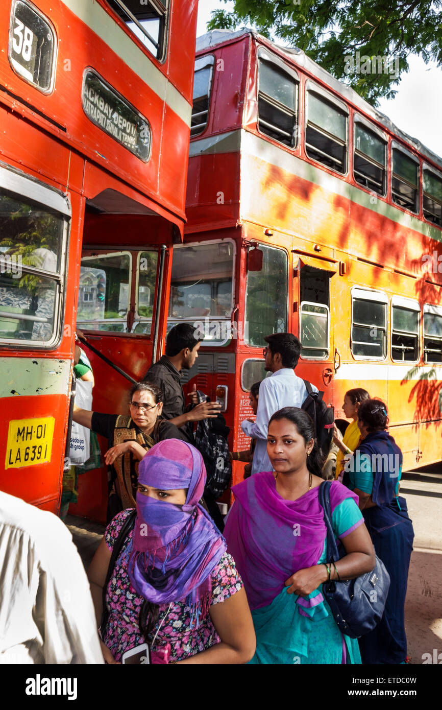 Mumbai India,Indian Asian,Fort Mumbai,Chhatrapati Shivaji Railway Station Terminus Area,BEST bus,coach,double decker,stop,riders,passenger passengers Stock Photo