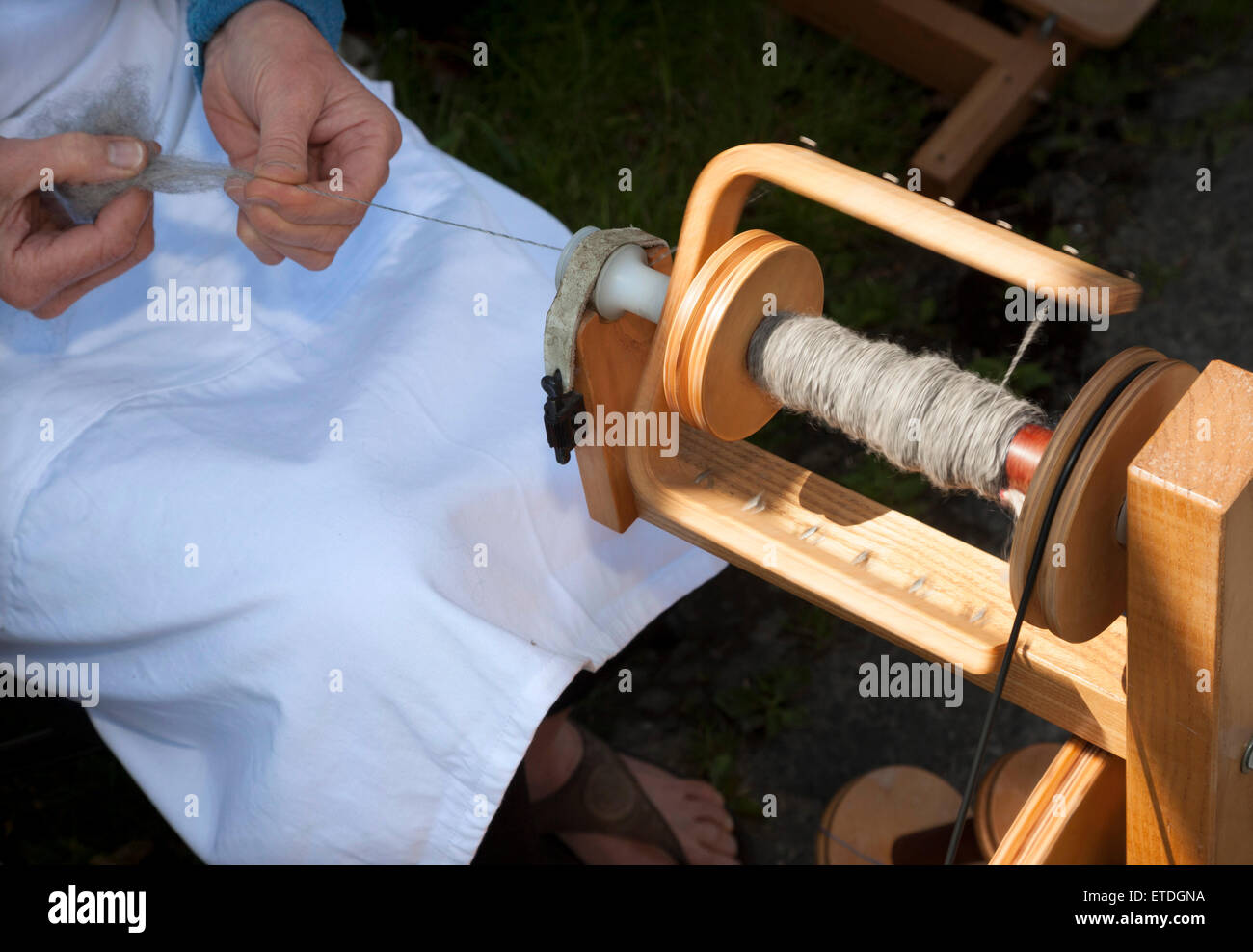 Spinning wool fleece to make yarn Stock Photo - Alamy