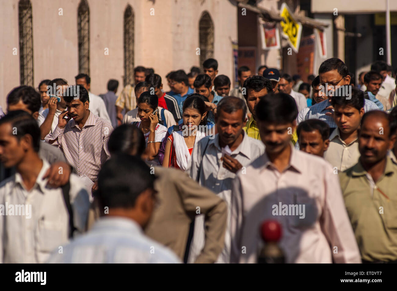 Indian commuters in the morning near Victoria Terminus, Mumbai, India Stock Photo