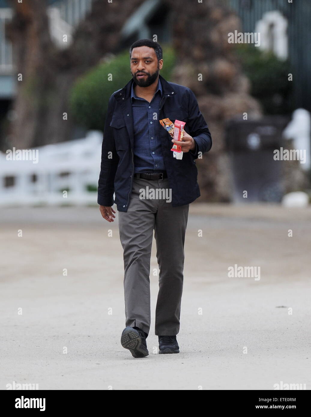 Oscar nominee '12 Years A Slave' star Chiwetel Ejiofor spotted on the set of 'The Secret In Their Eyes' filming in Pasadena Ca. The actor was joined by co star Dean Norris from 'Breaking Bad' and Daniel Moder as the cinematographer for the film. Daniel's famous wife Julia Roberts is also casted for the film.  Featuring: Chiwetel Ejiofo Where: Pasadena, California, United States When: 28 Jan 2015 Credit: Cousart/JFXimages/WENN.com Stock Photo