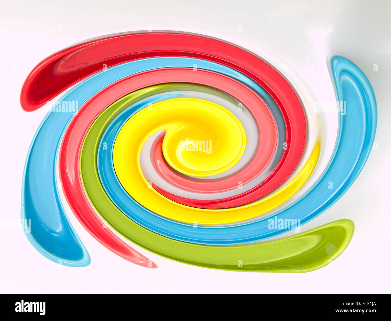 Light blue, green, yellow and pink twirling strips abstract background Stock Photo