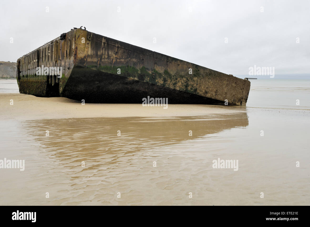 Remains of World War 2 Mulberry temporary harbour at Arromanches, France Stock Photo