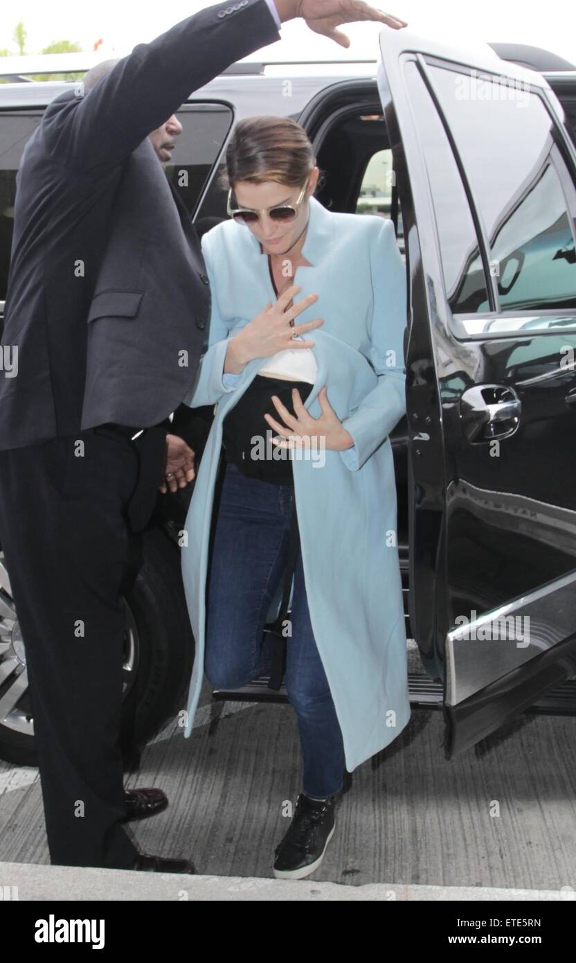 Actress Cobie Smulders carries her new baby as she departs from LAX