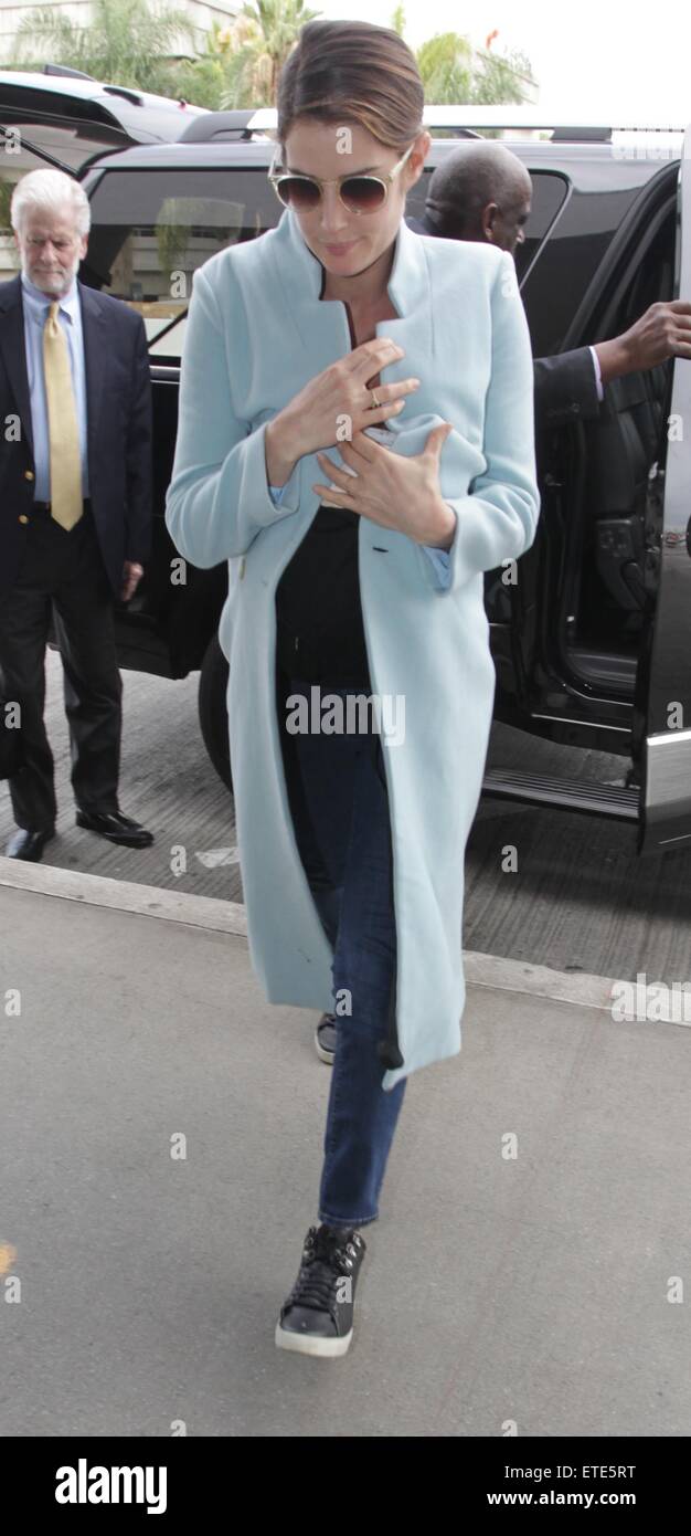 Actress Cobie Smulders carries her new baby as she departs from LAX