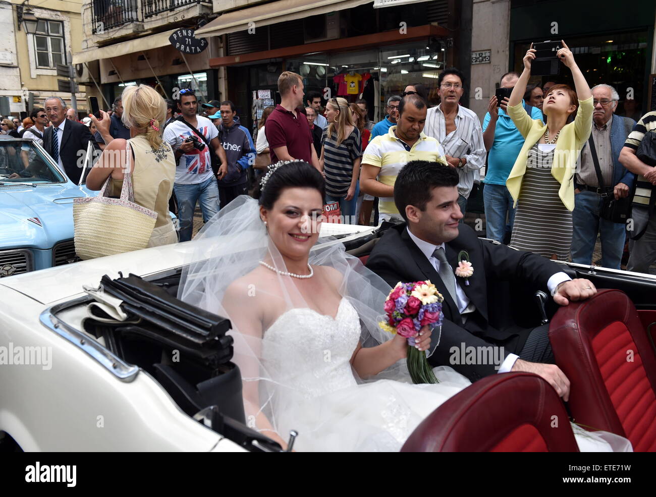 (150613) -- LISBON, June 13, 2015 (Xinhua) -- A couple of newly-weds participates in a group wedding in Lisbon, Portugal, on June 12, 2015. A total of 11 couples married during a group wedding at Lisbon city cathedral Friday. (Xinhua/Zhang Liyun) (zhf) Stock Photo