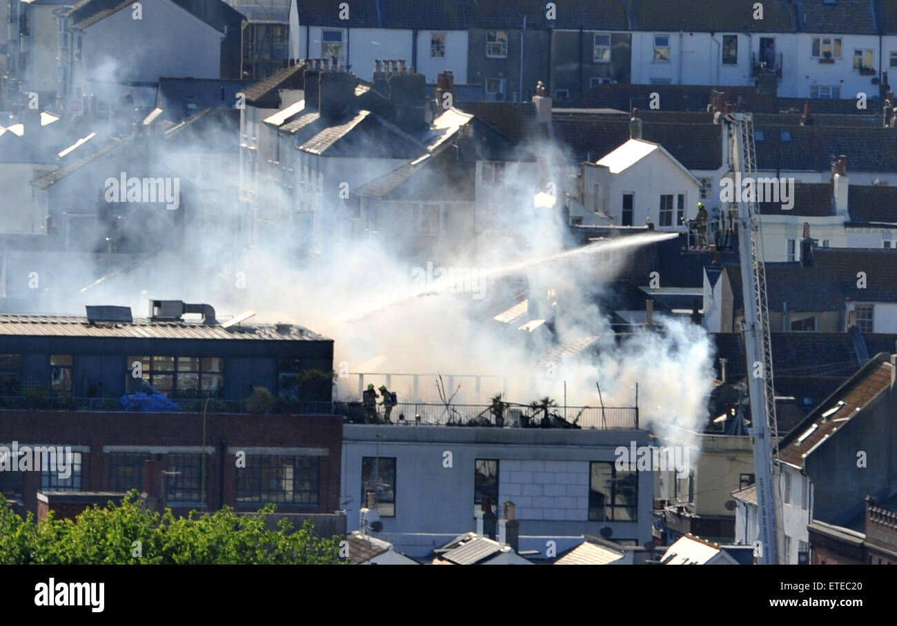 Loft Firefighting Brighton UK 11th June 2015 - The fire brigade tackle a blaze on the ...