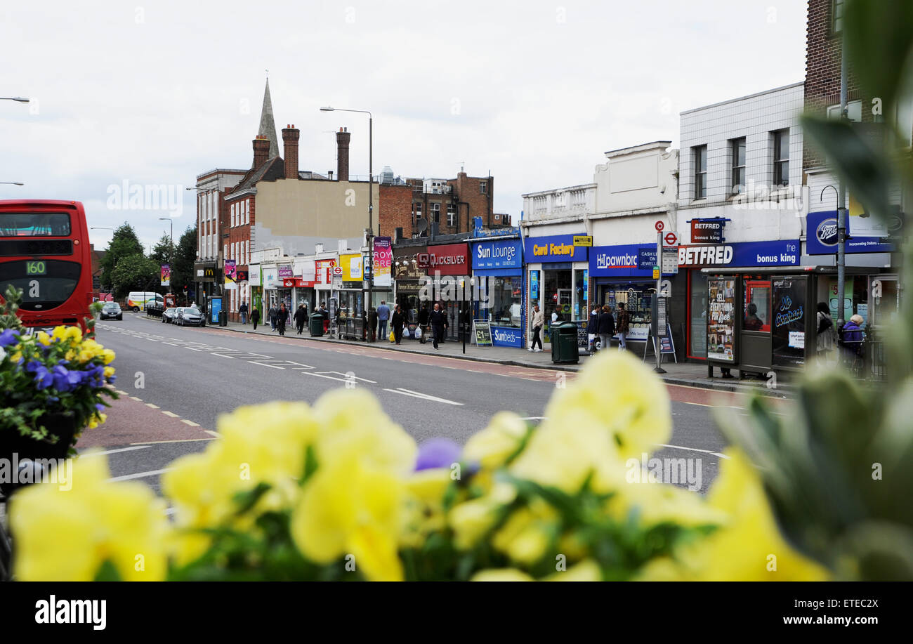 Eltham South East London UK Eltham High Street with shoppers and people and traffic Stock