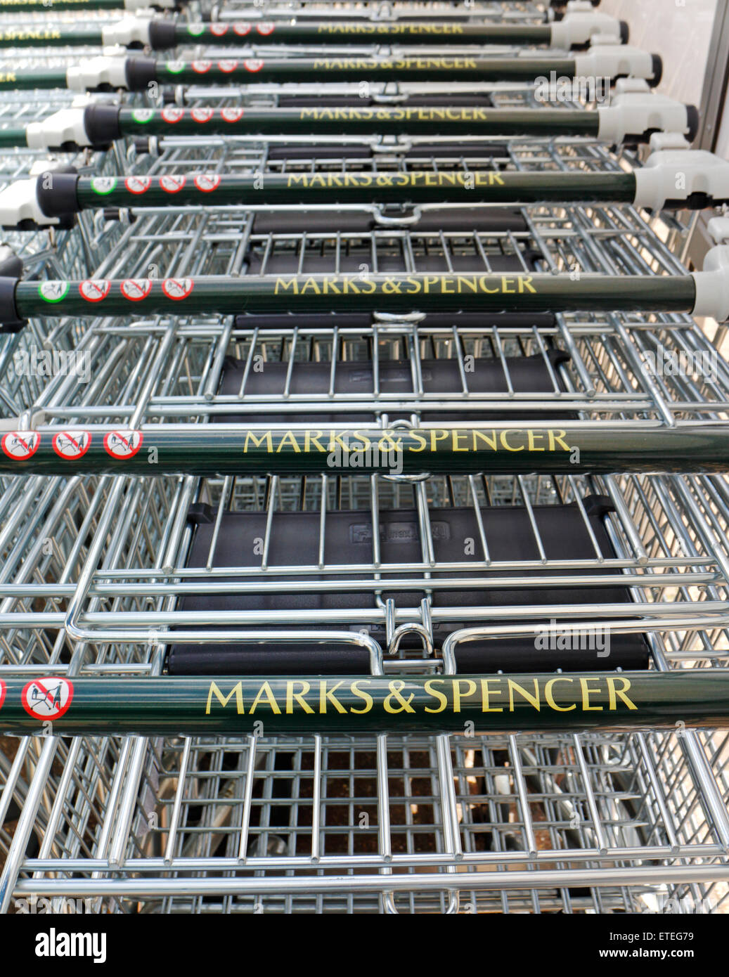 A row of Marks & Spencer shopping trolleys at a retail park in Norwich, Norfolk, England, United Kingdom. Stock Photo