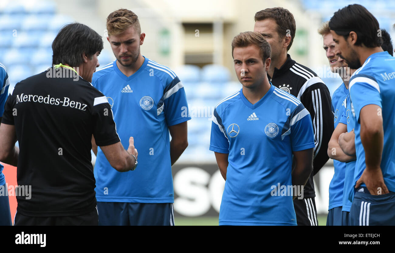 Faro, Portugal. 12th June, 2015. German head coach Joachim Loew (l) talks to Christoph Kramer (l-r), Mario Goetze, Oliver Bierhoff, Andre Schuerrle and Sami Khedira during a training session at the Algarve Stadium of Faro, Portugal, 12 June 2015. Germany will face Gibraltar in the European qualifiers in Faro on 13 June 2015. Photo: Arne Dedert/dpa/Alamy Live News Stock Photo