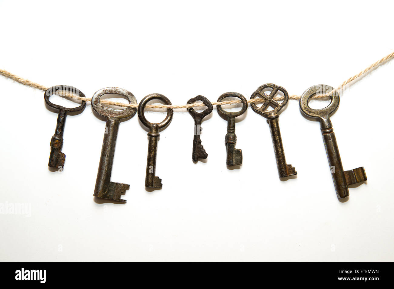Some vintage keys from the locks on a white background Stock Photo - Alamy