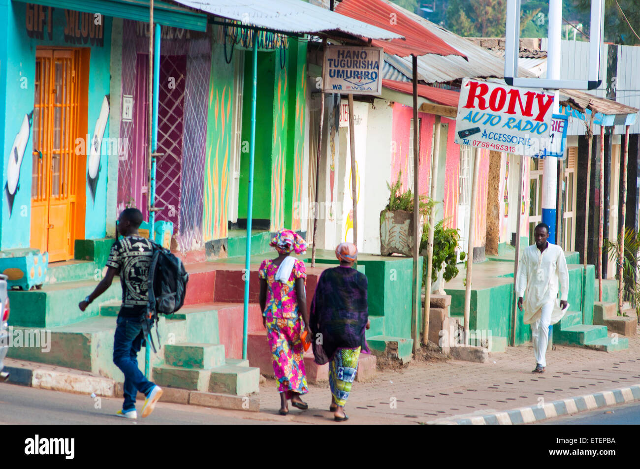 Street scene with brightly painted shops, Nyamirambo, Kigali, Rwanda Stock Photo