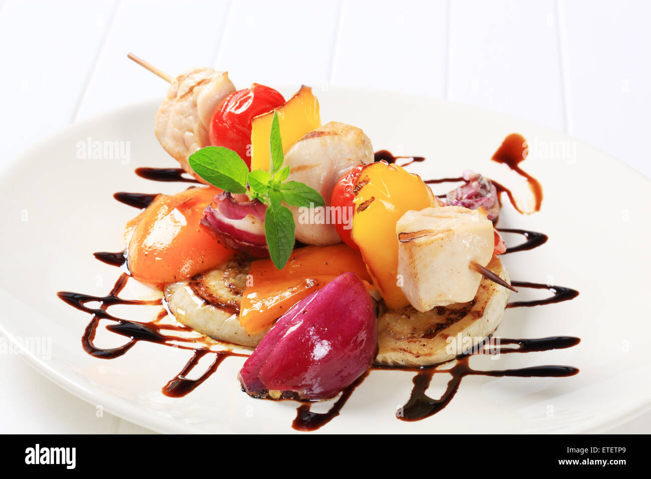 Chicken skewer with pan roasted vegetables and balsamic vinegar Stock Photo Alamy