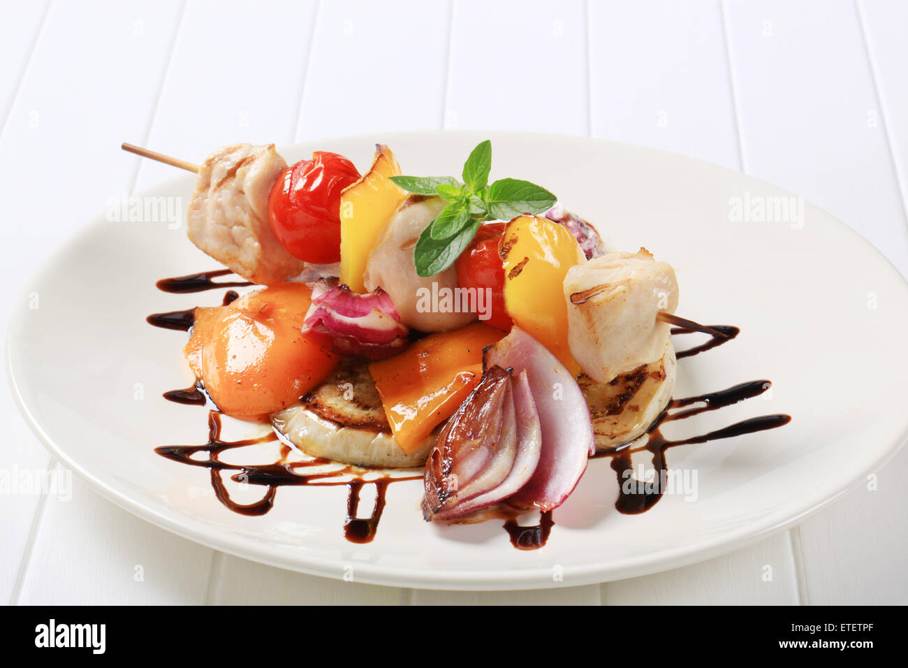 Chicken skewer with pan roasted vegetables and balsamic vinegar Stock Photo Alamy