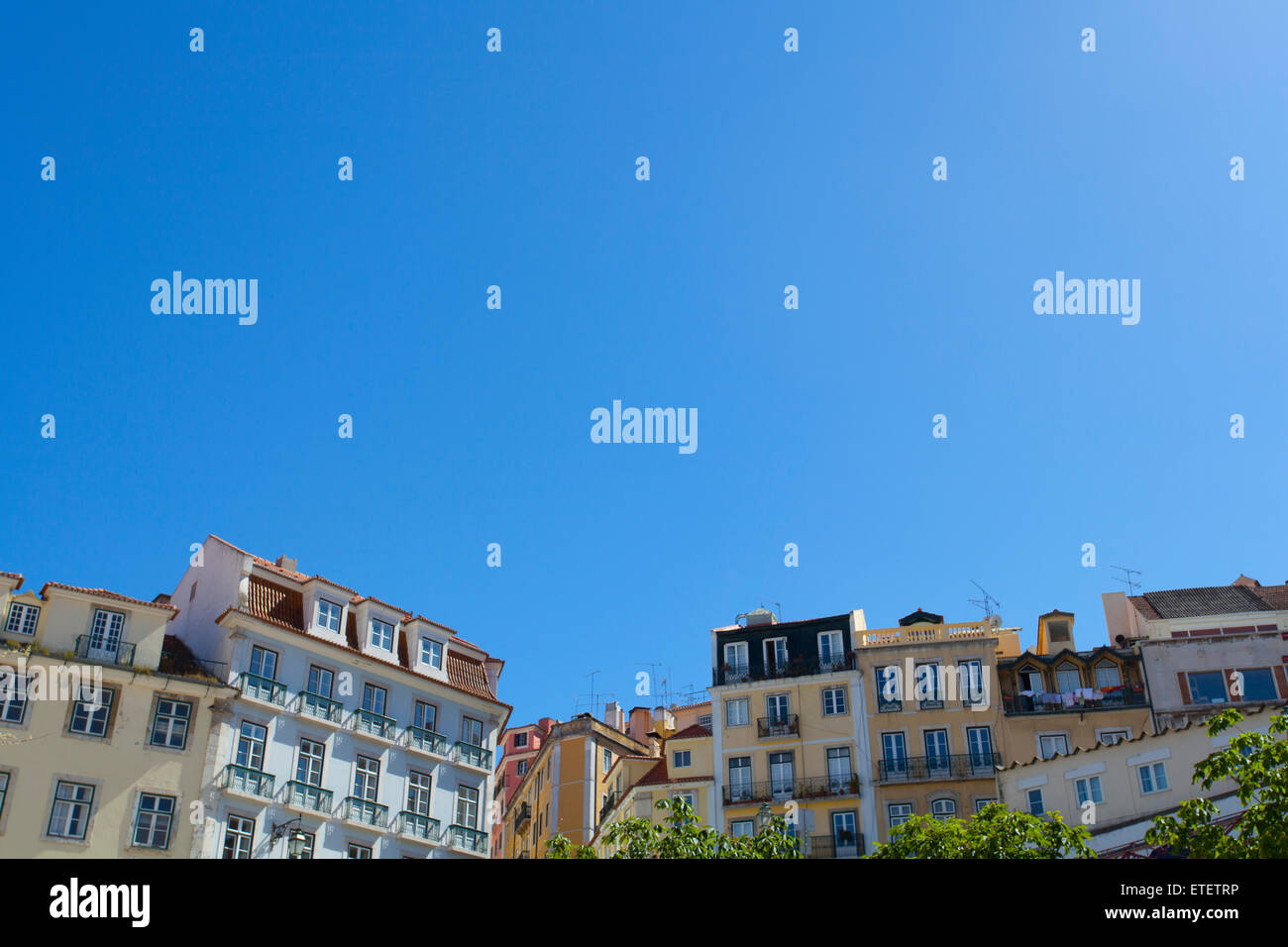 Lisbon buildings against a bright blue sky Stock Photo