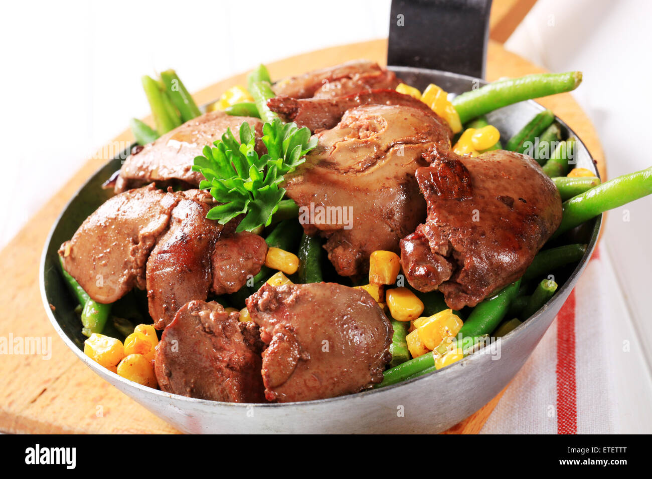 Panfried chicken livers with green beans and sweetcorn Stock Photo Alamy