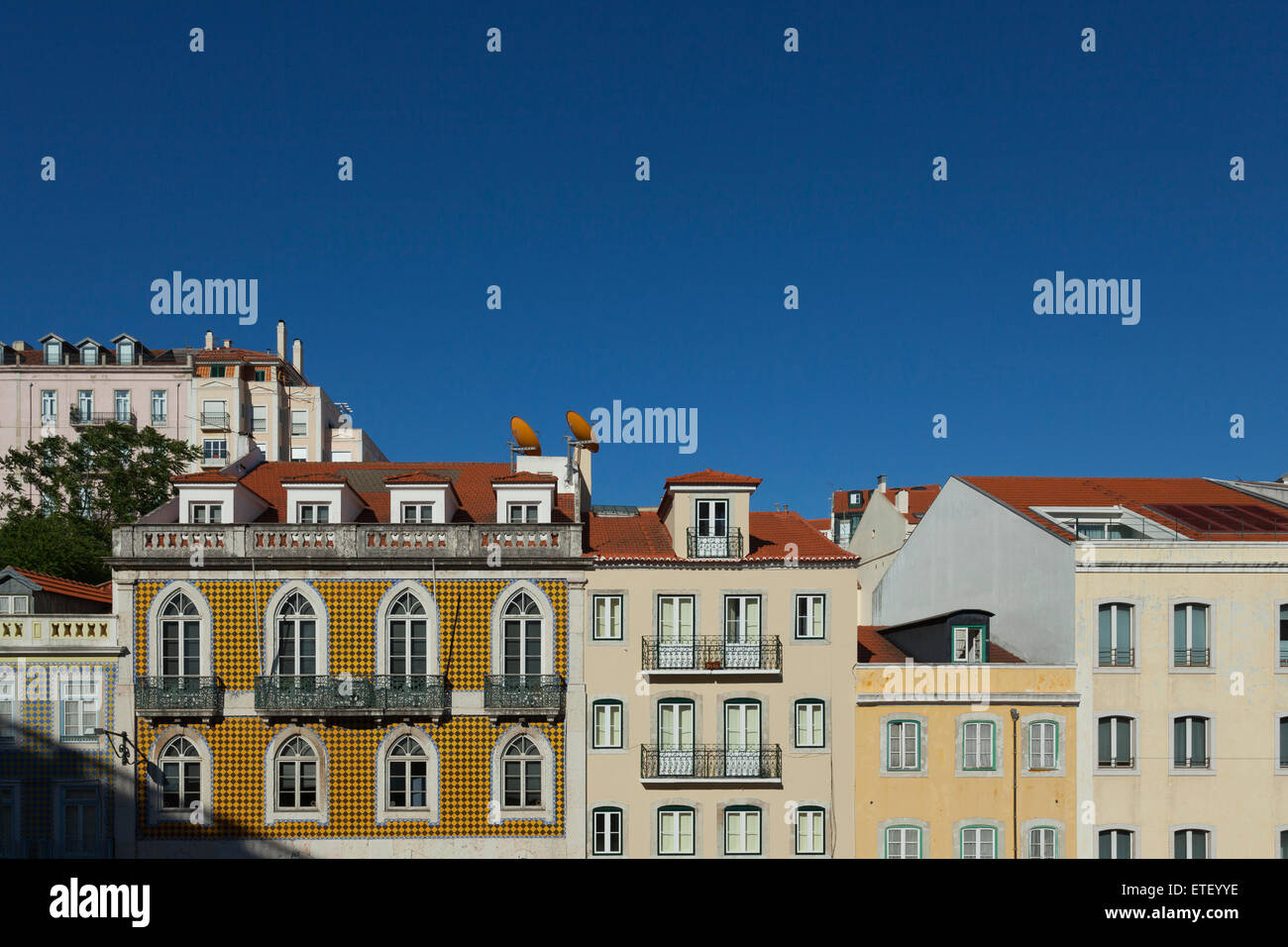Close up of some pombaline buildings in Lisbon set against a deep blue sky Stock Photo