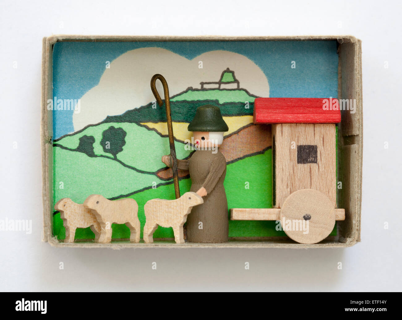 Vintage Matchbox containing hand made wood folk art toy. Erzgebirgische Volkskunst in der Zundholzschachtel Stock Photo