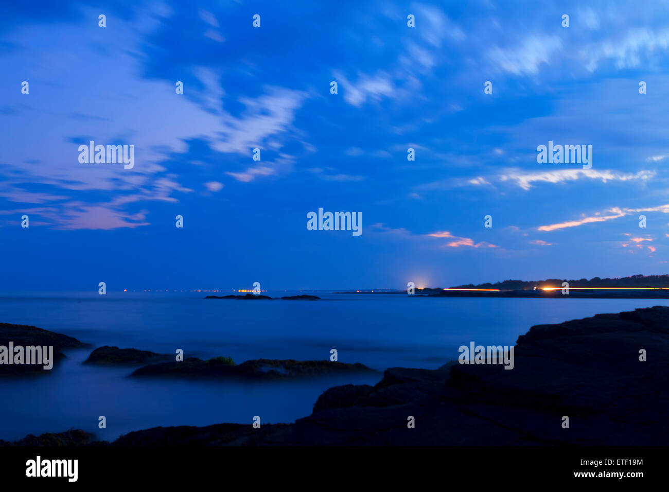 Sunset on a rocky shore Stock Photo - Alamy