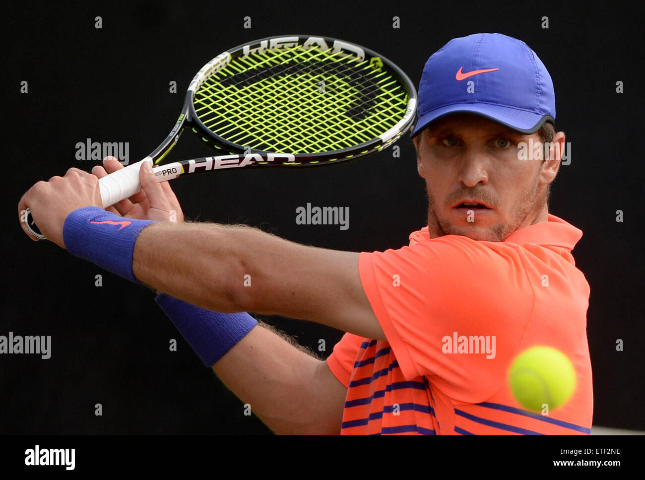 Stuttgart, Germany. 12th June, 2015. Mischa Zverev of Germany plays a  backhand during the quarter final of the ATP tennis tournament against  Cilic of Croatia in Stuttgart, Germany, 12 June 2015. PHOTO: