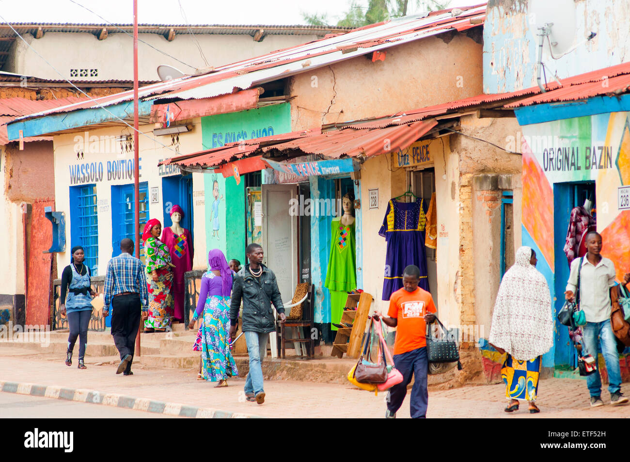 Main street scene with brightly painted shops, Nyamirambo, Kigali, Rwanda Stock Photo