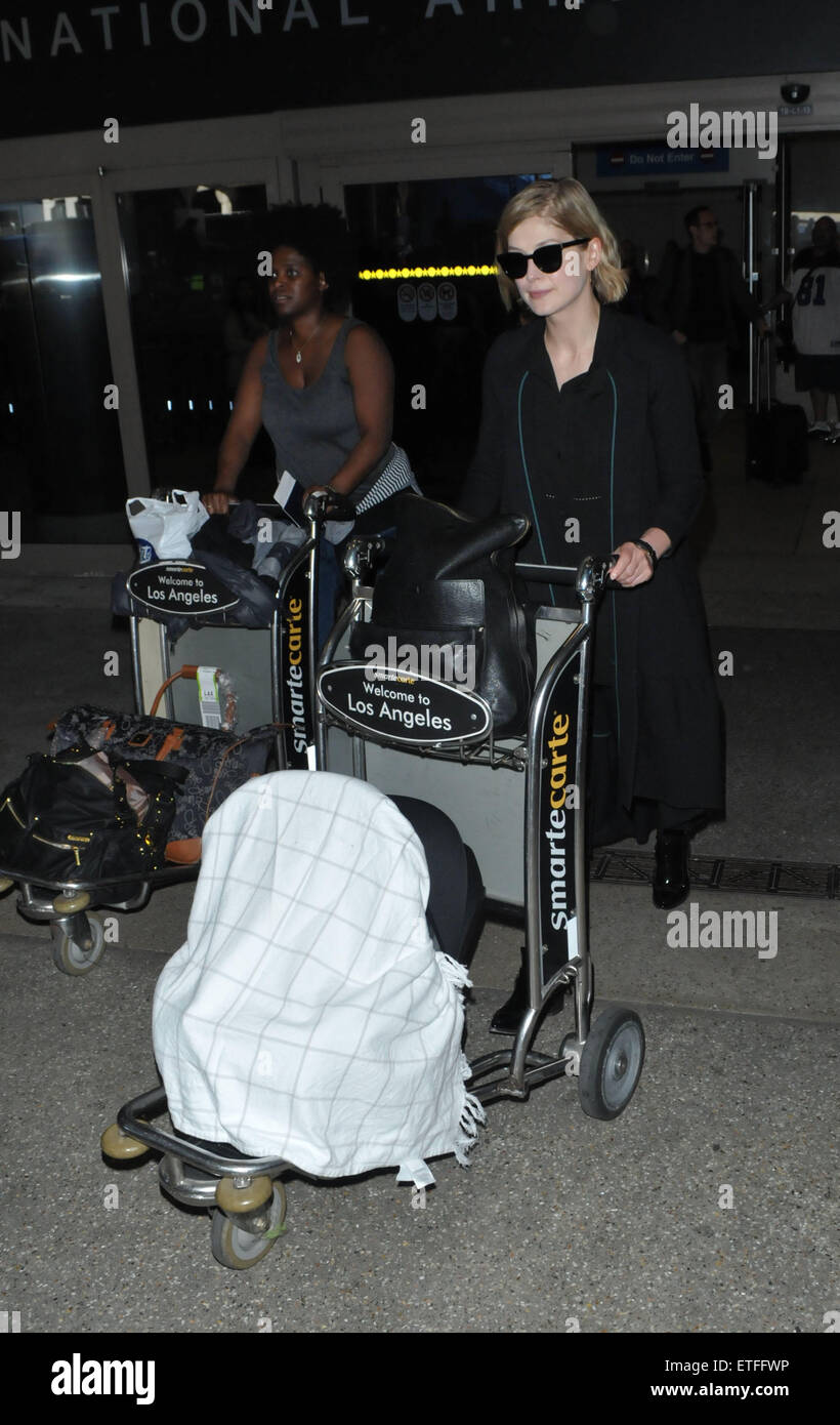 Rosamund Pike arrives at Los Angeles International Airport (LAX) using a novel way of using an airport trolley to push baby Solo Uniacke  Featuring: Rosamund Pike Where: Los Angeles, California, United States When: 09 Feb 2015 Credit: MONEY$HOT/WENN.com Stock Photo