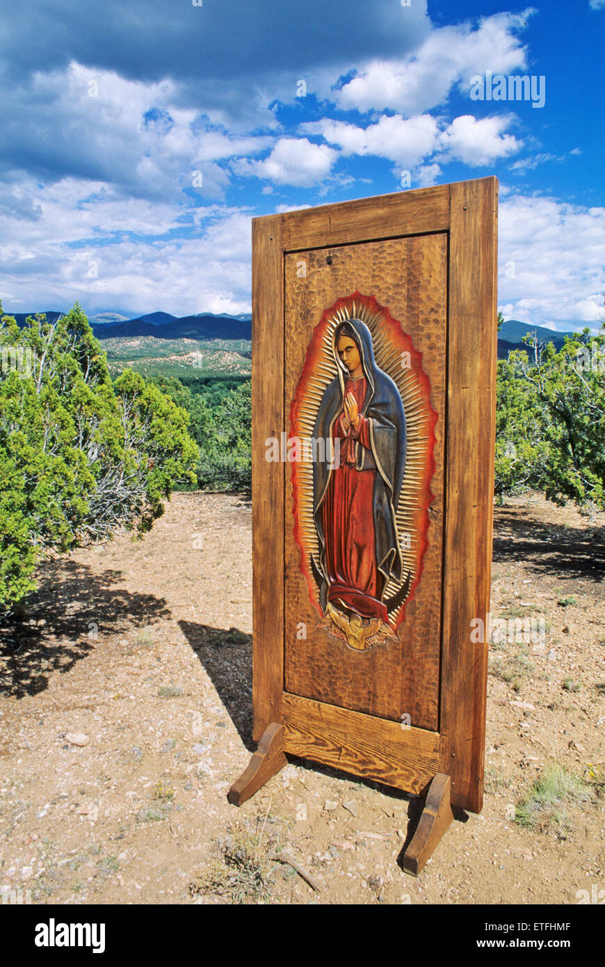 Woodcarver Kirk Kirkpatrick carved and stained a wooden door to produce this image of the Virgin of Guadalupe in Santa Fe. Stock Photo