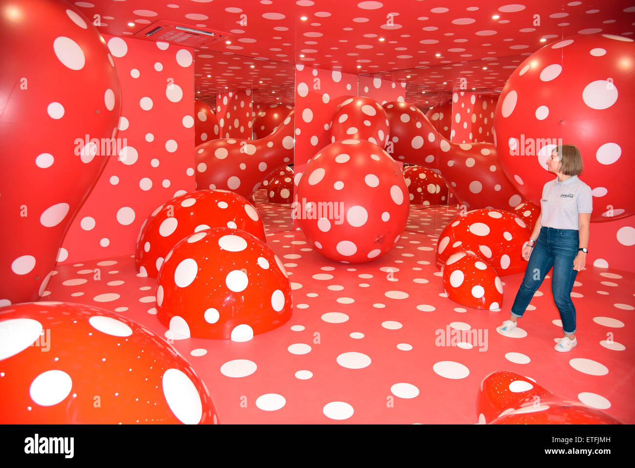 Moscow, Russia. 10th June, 2015. A woman looks at an installation entitled 'Infinity Theory' by Japanese artist Yayoi Kusama in the Garage Museum of Contemporary Art in Moscow, Russia, 10 June 2015. The largest museum for contemporary art in Russia has moved into its new building at Gorky Park. Photo: Ulf Mauder/dpa/Alamy Live News Stock Photo