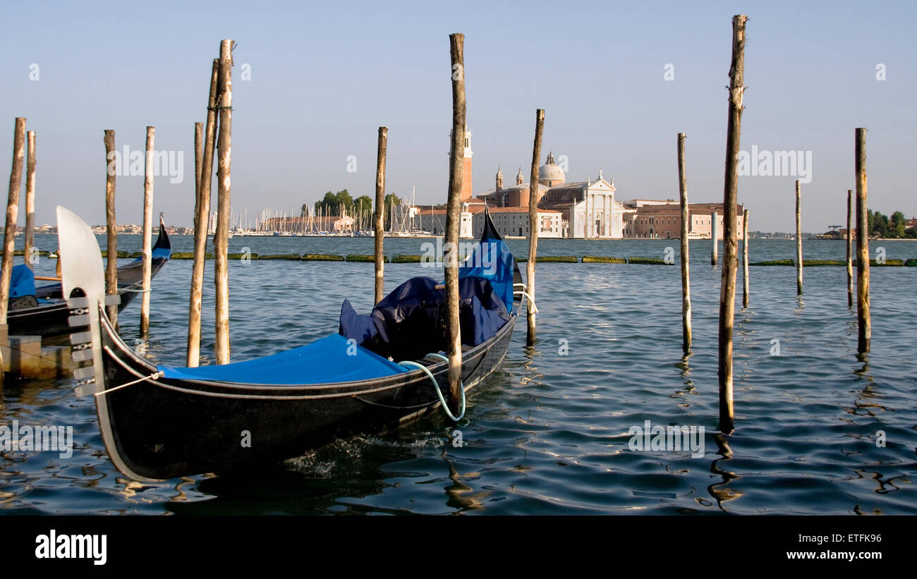 Gondola on a pier in the Venetian Lagoon, Italy. Stock Photo