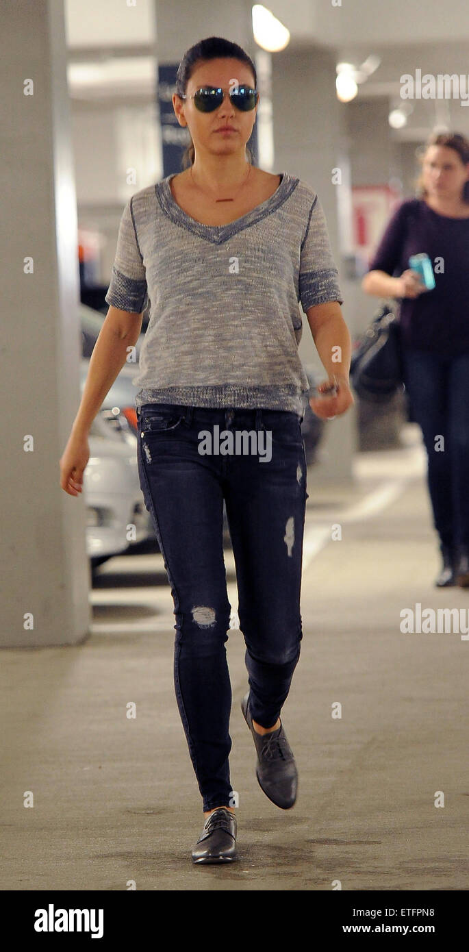 Mila Kunis seen in a car park wearing sunglasses grey top and skinny jeans Featuring Mila Kunis Where Los Angeles California United States When 11 Feb 2015 Credit WENN Stock Photo Alamy