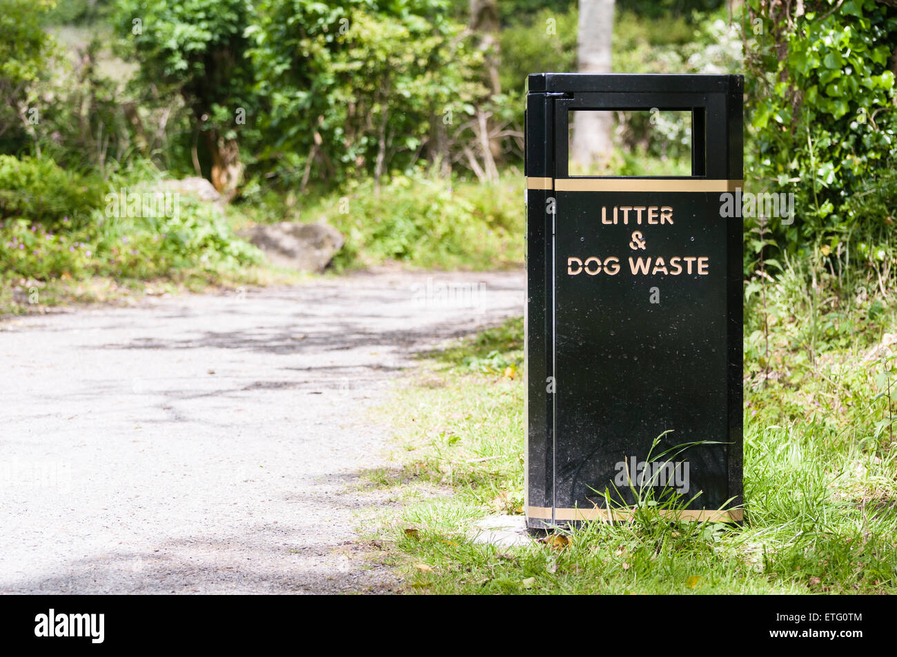 Litter and dog waste bin in a public park. Stock Photo