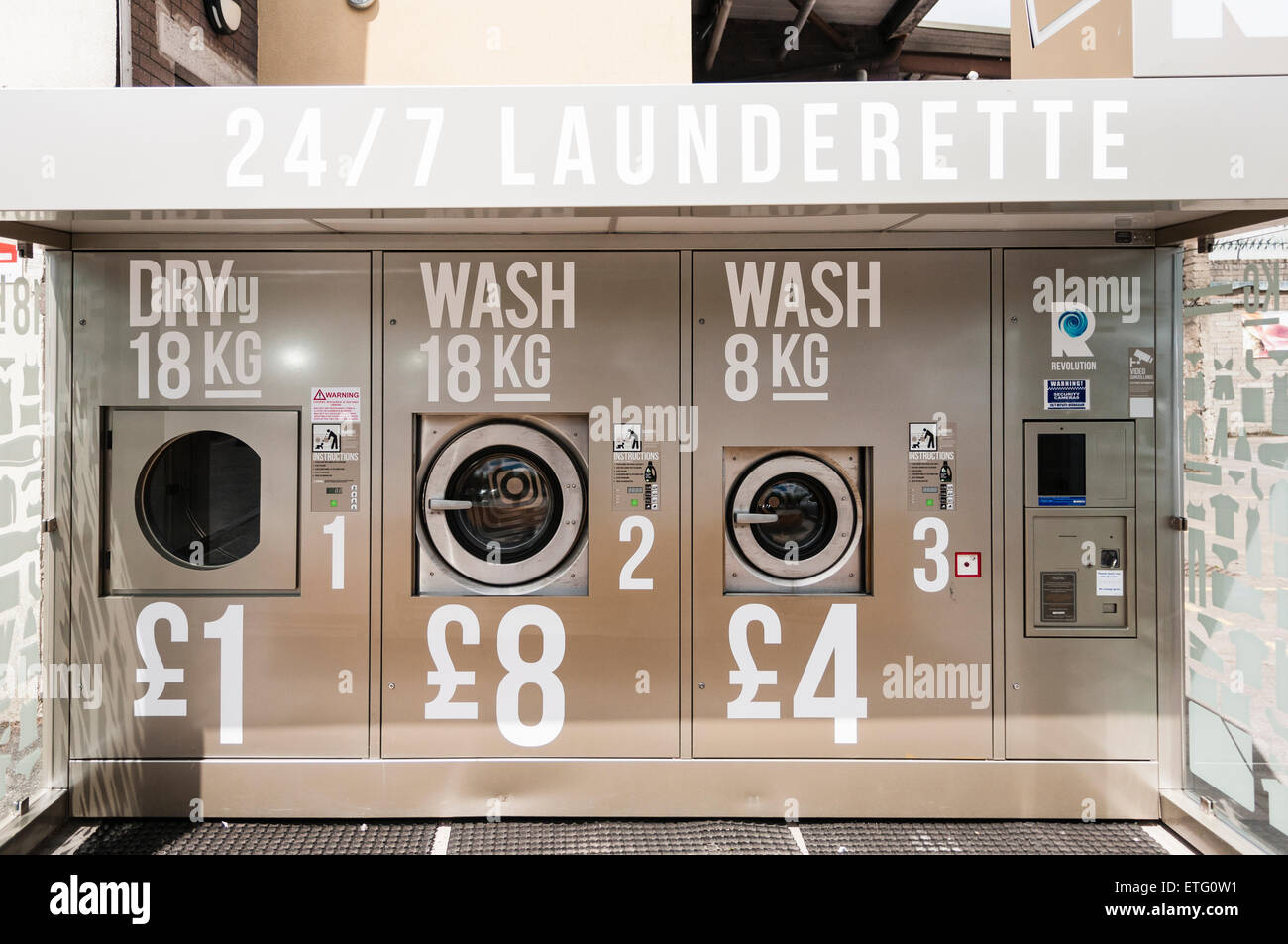 Automatic outdoor launderette allowing people to dry and wash clothes. Stock Photo