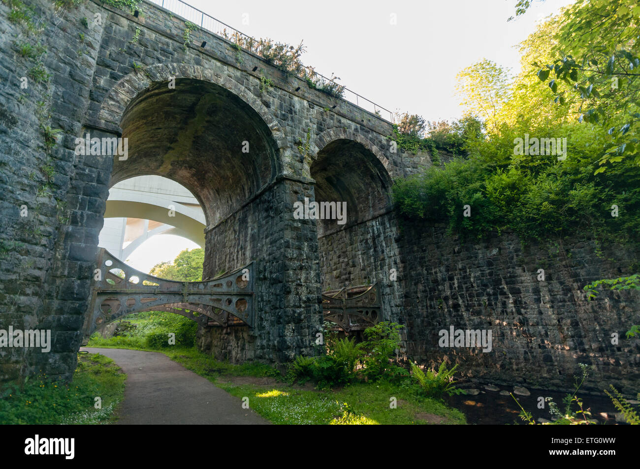 Victorian railway stone viaduct with iron braces Stock Photo