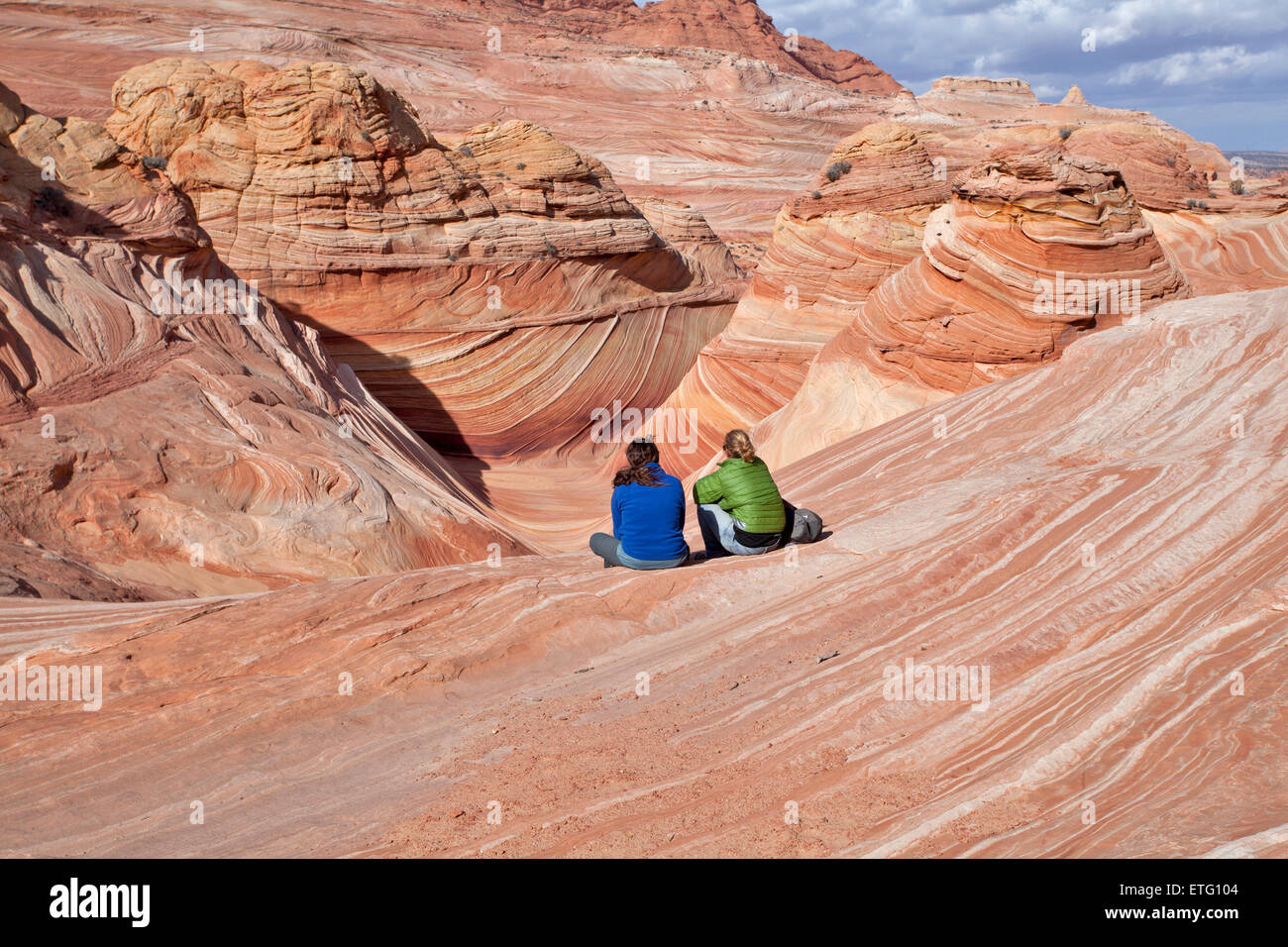 The Wave and other colorful rock formations attract many hikers and  tourists to the North Coyote Buttes  area of the Paria Cany Stock Photo