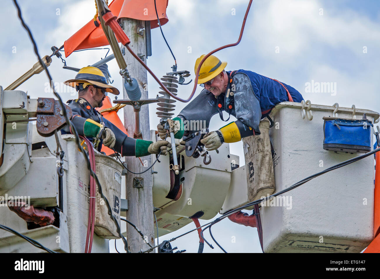 Electrical line workers use an elevated work platform called a 'cherry