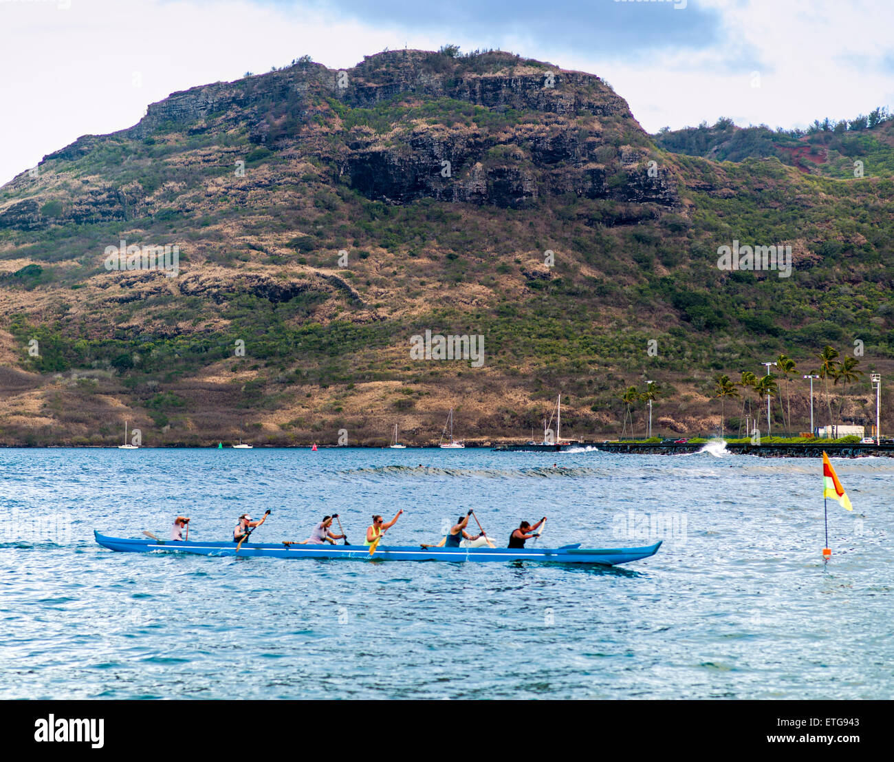 Native paddlers in outrigger canoe, Kalapaki Beach, Kaua'i, Hawai'i, USA Stock Photo