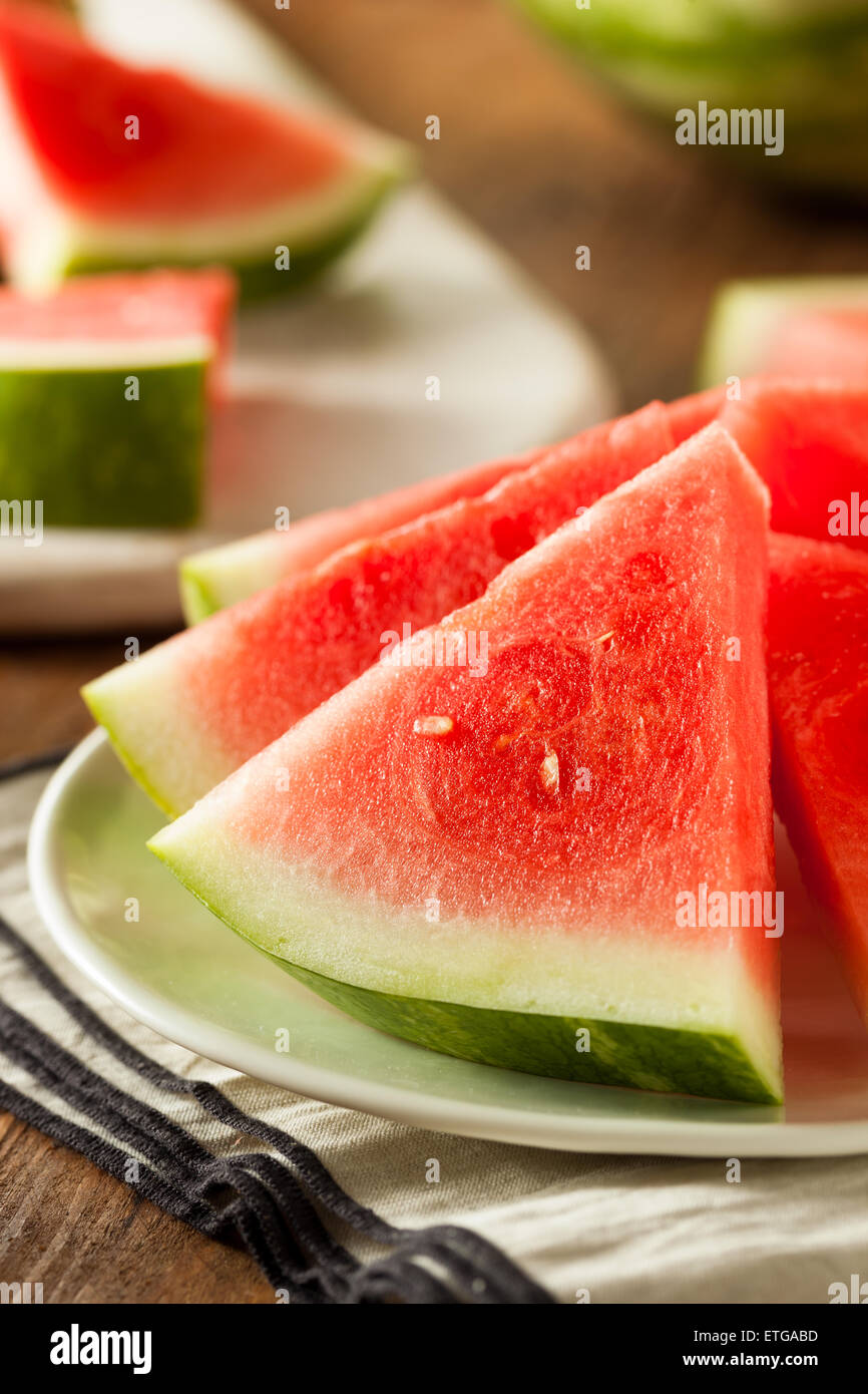 Organic Ripe Seedless Watermelon Cut into Wedges Stock Photo