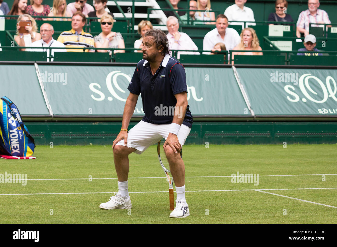 Halle Westfalen, Germany. 13th Jun, 2015.  Henri Leconte jokes around during his Champions' Trophy match at the start of the Gerry Weber Open. Stock Photo