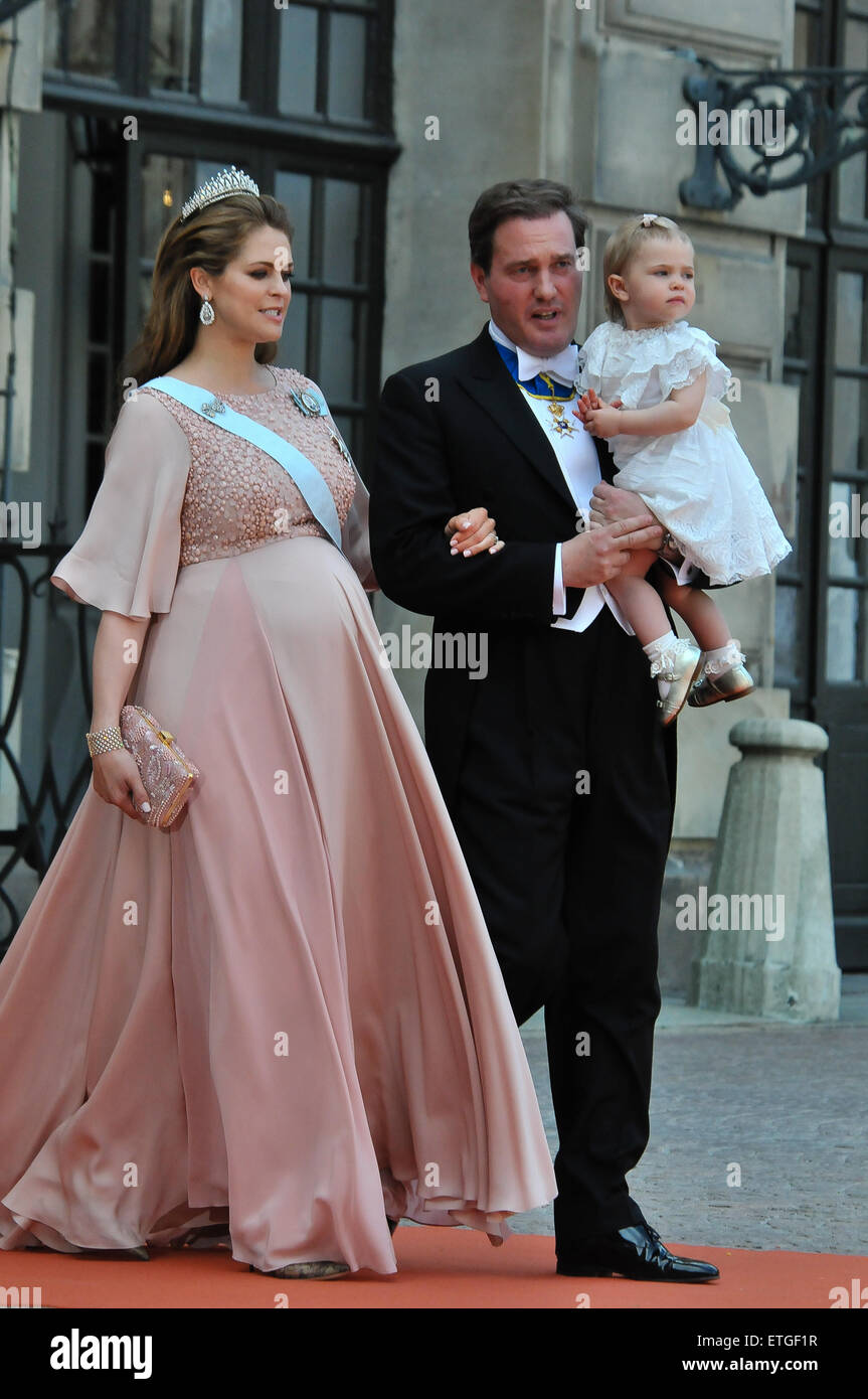Stockholm, Sweden. 13th June, 2015. Sweden's Princess Madeleine, her husband Christopher O'Neill and their daughter Princess Lenore walk on their way to attend the wedding ceremony of Sweden's Prince Carl Philip and Sofia Hellqvist at the Raoyal Chapel at Stockholm Palace in Stockholm, Sweden, June 13, 2015. © Rob Schoenbaum/Xinhua/Alamy Live News Stock Photo