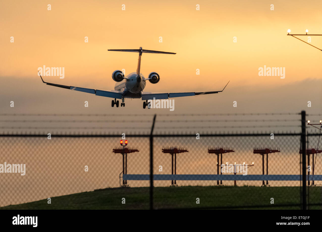 Commercial airline passenger jet landing at Hartsfield-Jackson Atlanta International Airport at sunset in Atlanta, Georgia, USA. Stock Photo