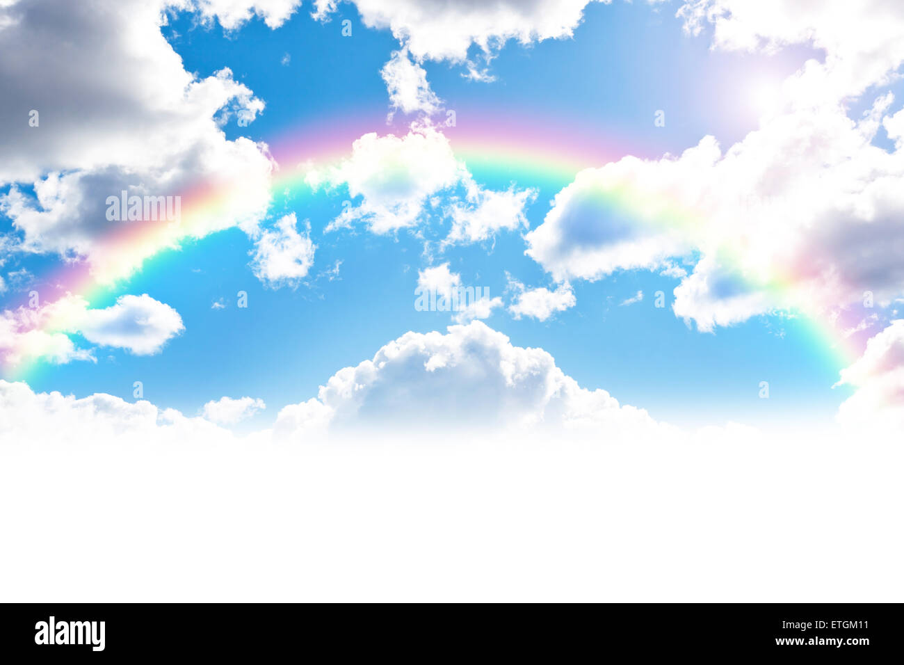 Blue cloudly sky background with colorful rainbow Stock Photo - Alamy